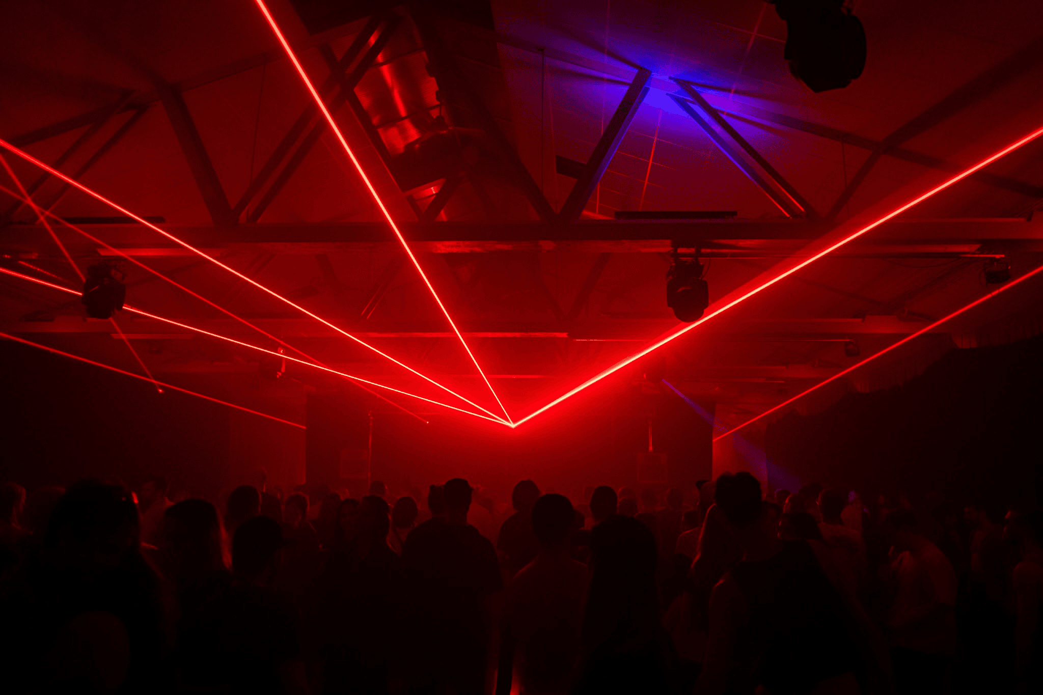 Red laser fan over the dance floor